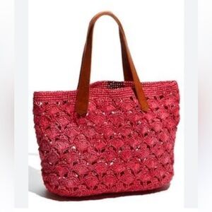 Mar Y Sol woven bag featuring a crochet raffia design with leather handles.